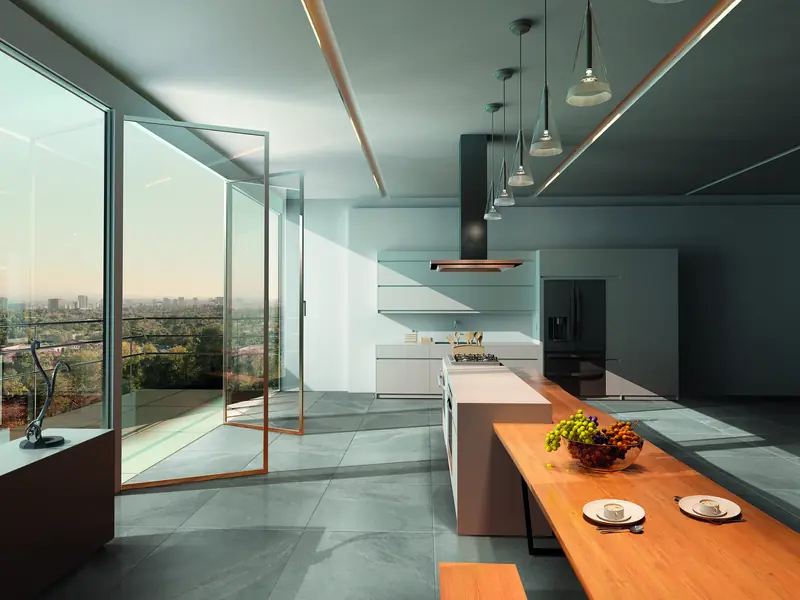 Open-plan kitchen with a grey stone-effect Sassuolo porcelain tile floor